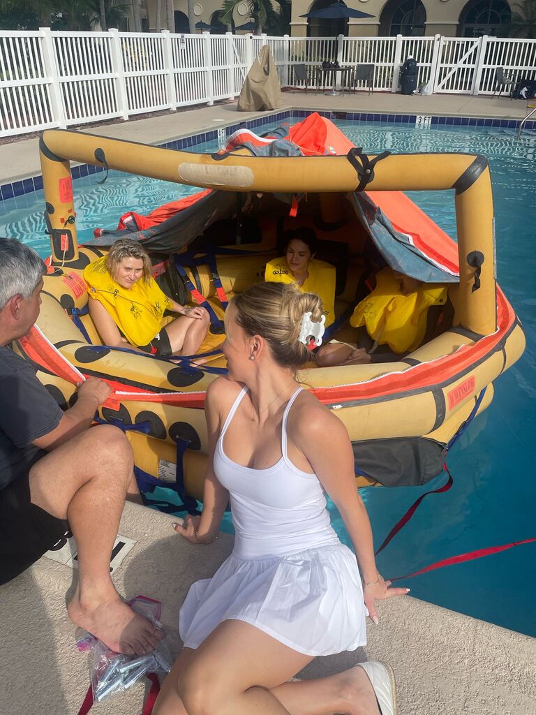 Students in a life raft during the water survival drill