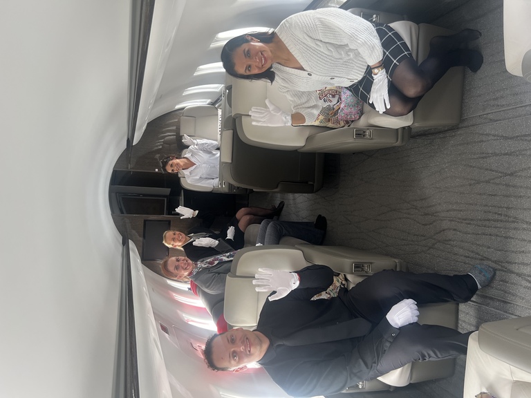 Students seated in a business jet cabin during an onboard session